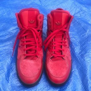 Red suede adidas sneakers